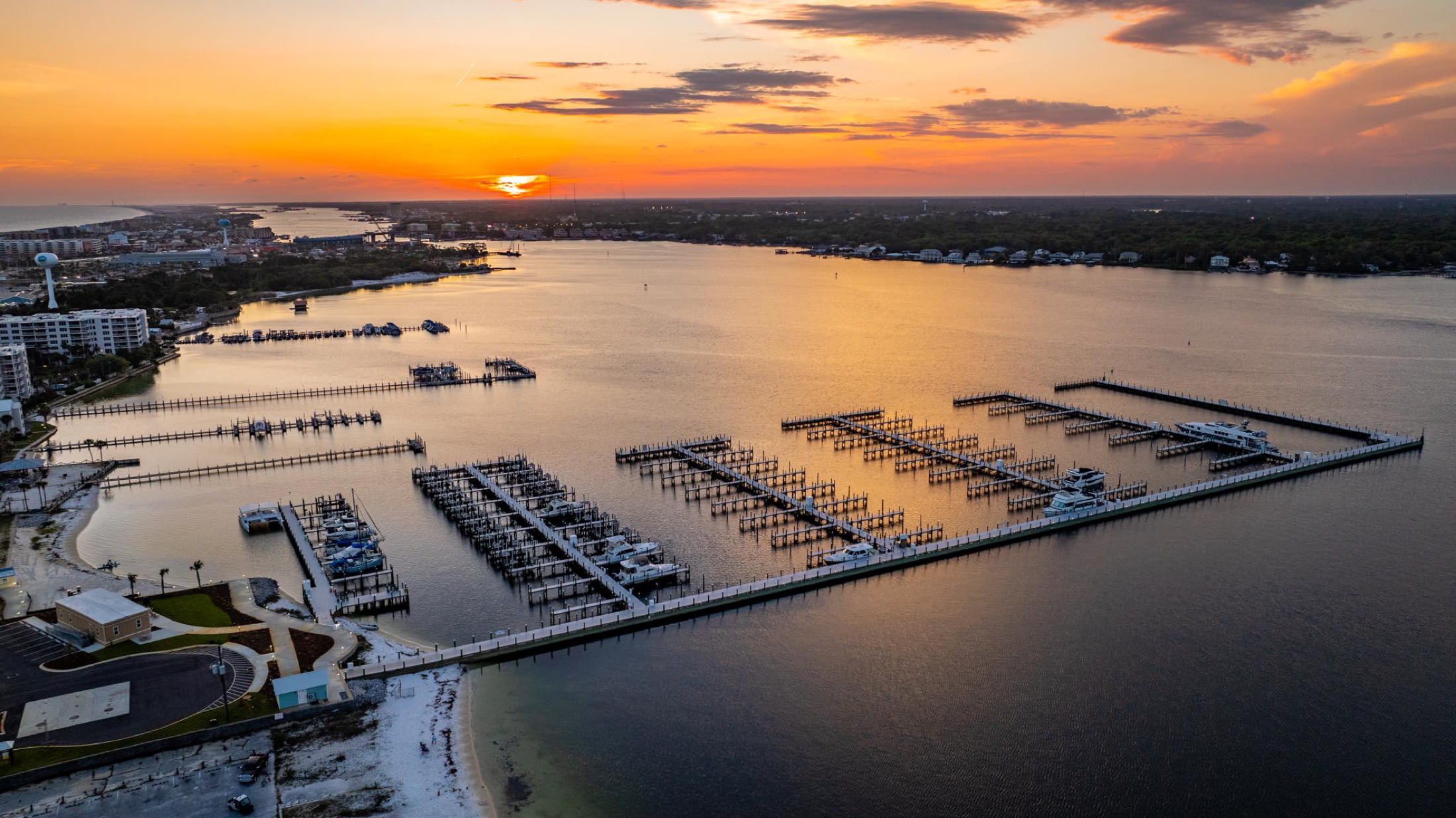 Boats along a waterfront at golden hour